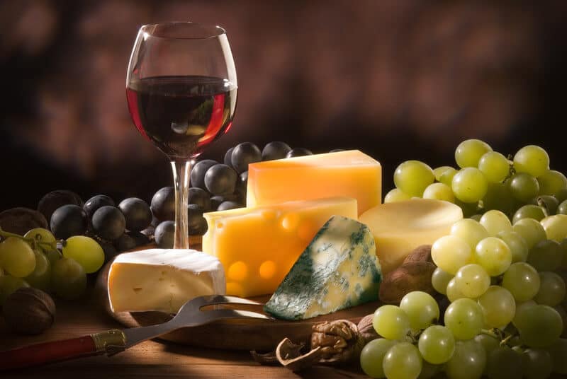 Cheese, red wine and grapes
